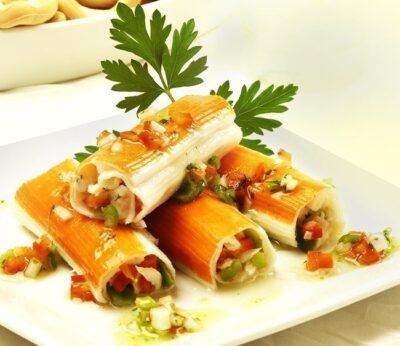 Canelones de barritas Krissia con merluza y vinagreta de pimientos