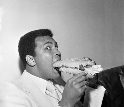Muhammad Ali in Newcastle eating a Stottie cake 1977
