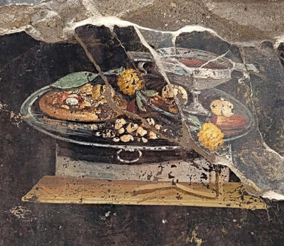 Una proto-pizza emerge de un fresco hallado en Pompeya