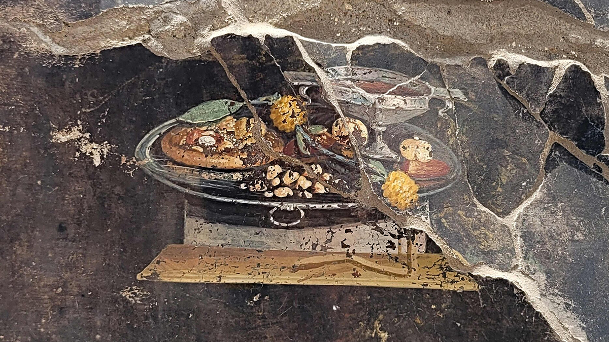 A proto-pizza emerges from a fresco found in Pompeii