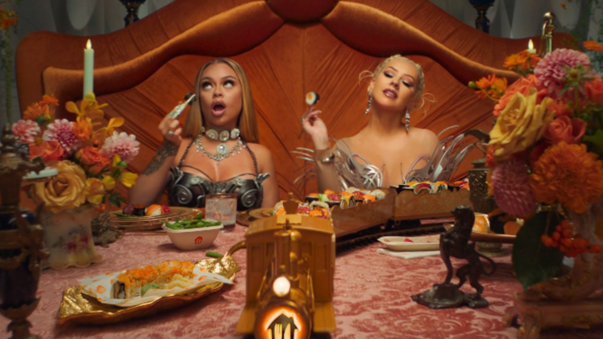 Christina Aguilera and Latto serve up big doses of food, rap and opera in the new Just Eat clip