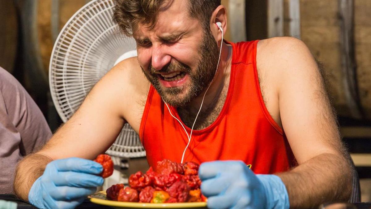 This is the record for eating the most Carolina Reaper, the hottest chili in the world, in less time